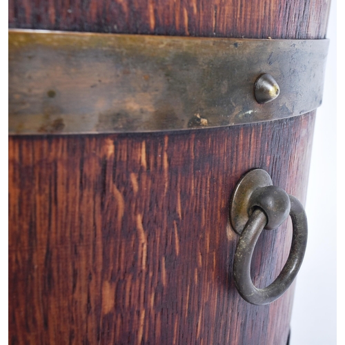 235 - An early 20th century Lister of Dursley made coopered oak barrel planter. Traditionally made, with b... 