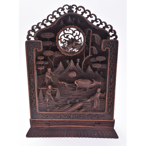 24 - A 19th century Chinese Cantonese carved wood book slide. The slide intricately carved throughout scr... 