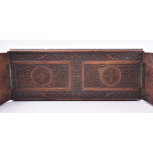 24 - A 19th century Chinese Cantonese carved wood book slide. The slide intricately carved throughout scr... 