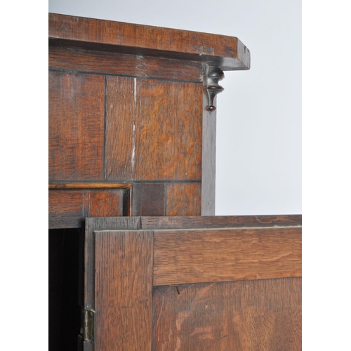 242 - A George III late 18th century oak & mahogany cross banded corner cupboard cabinet. The cabinet havi... 