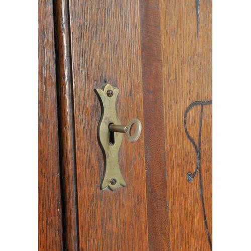 242 - A George III late 18th century oak & mahogany cross banded corner cupboard cabinet. The cabinet havi... 