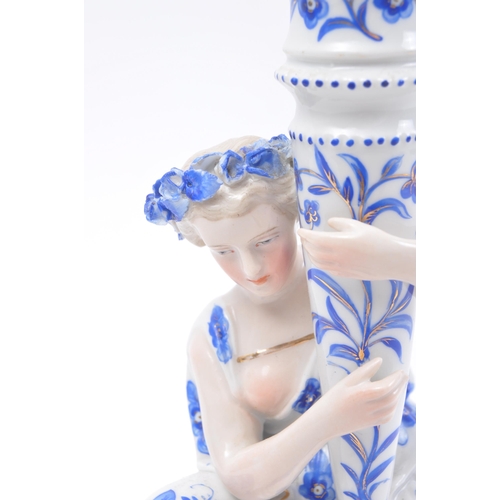 243 - An early 20th century Continental porcelain fine bone china figurative candle holder statuette in th... 