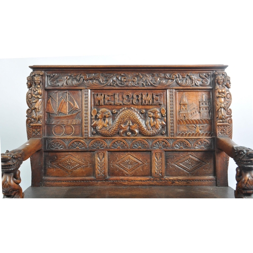 248 - A late 19th century Flemish Continental carved stained oak hall monk's settle bench. The bench decor... 