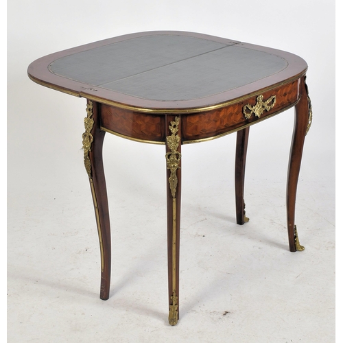 251 - A 20th century French parquetry inlaid fold-over card / games table. The D-shape table top enclosing... 