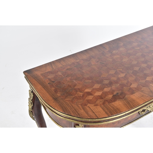 251 - A 20th century French parquetry inlaid fold-over card / games table. The D-shape table top enclosing... 