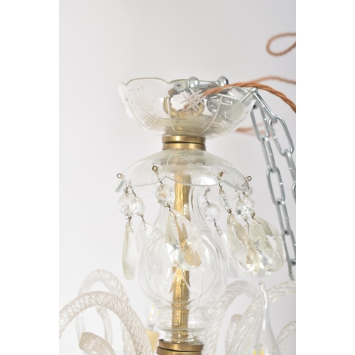 253 - A large 20th century two tier glass and brass chandelier. The chandelier having a central stem with ... 