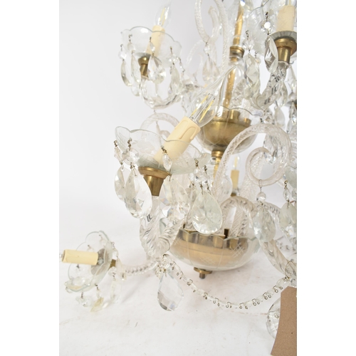 253 - A large 20th century two tier glass and brass chandelier. The chandelier having a central stem with ... 