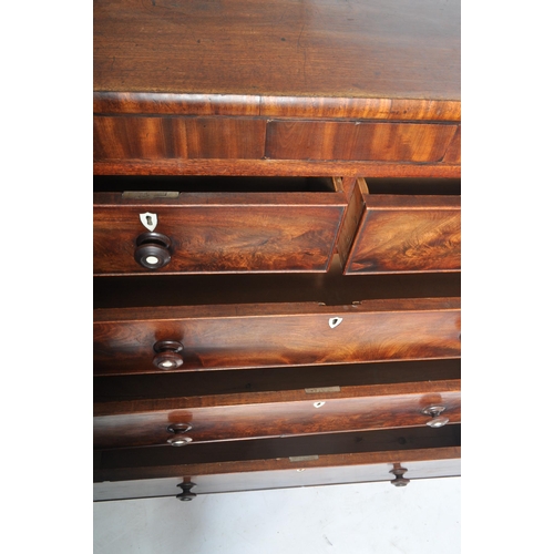 257 - A 19th century Victorian flame mahogany Scottish large chest of drawers. The chest being raised on b... 