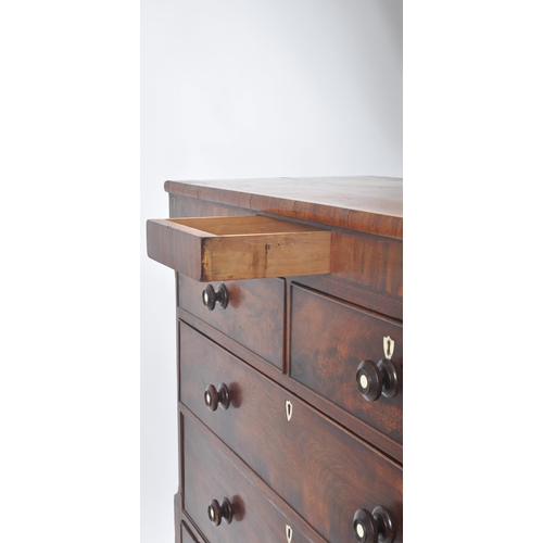 257 - A 19th century Victorian flame mahogany Scottish large chest of drawers. The chest being raised on b... 