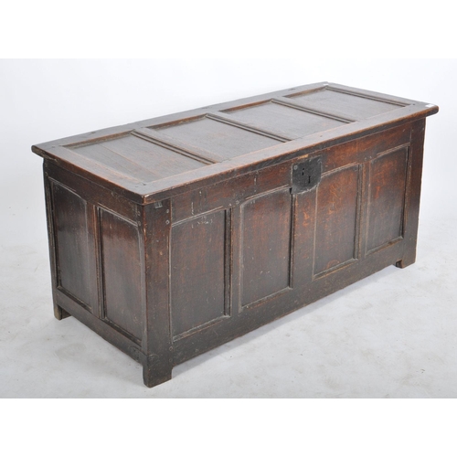 263 - A James I 17th century large country oak coffer chest. Raised on stile block legs with large, wide a... 