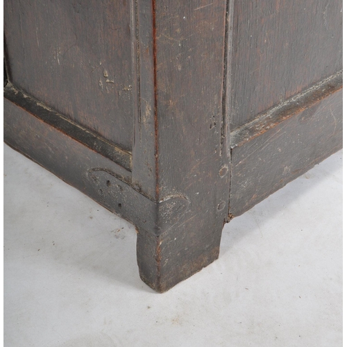 263 - A James I 17th century large country oak coffer chest. Raised on stile block legs with large, wide a... 