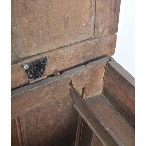 263 - A James I 17th century large country oak coffer chest. Raised on stile block legs with large, wide a... 