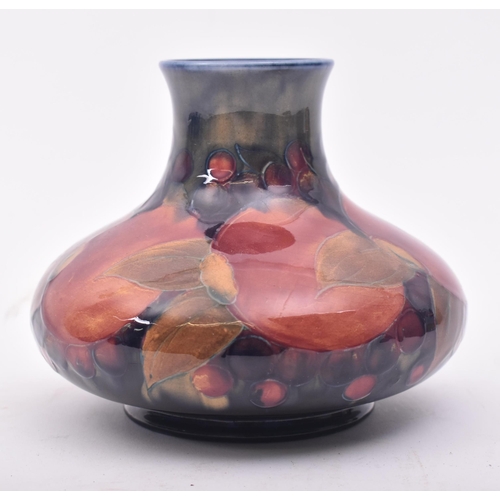 279 - Moorcroft - an early 20th century circa 1920s studio art pottery vase. The jar with pomegranate & gr... 