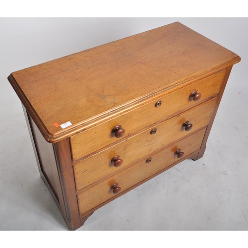 28 - A 19th century Victorian mahogany chest of drawers of low form. The chest having a straight bank of ... 