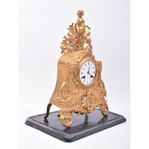 30 - A 19th century French gilt ormolu mantle clock by Vincenti & Cie. The mantel clock having a muse-lik... 