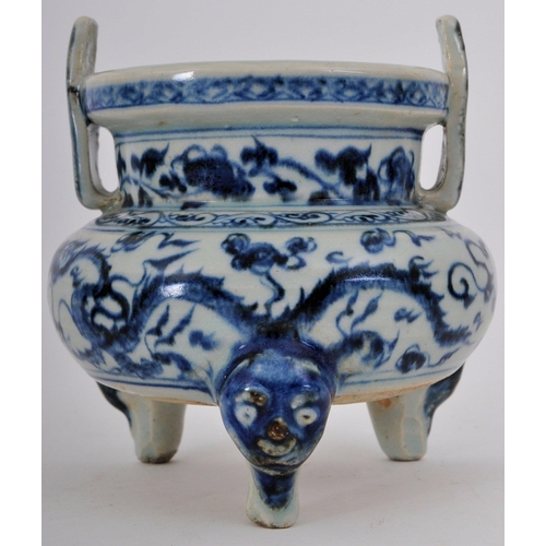 317 - A 19th century Chinese Qing Dynasty blue & white ceramic tripod censor. The censor having twin slip ... 