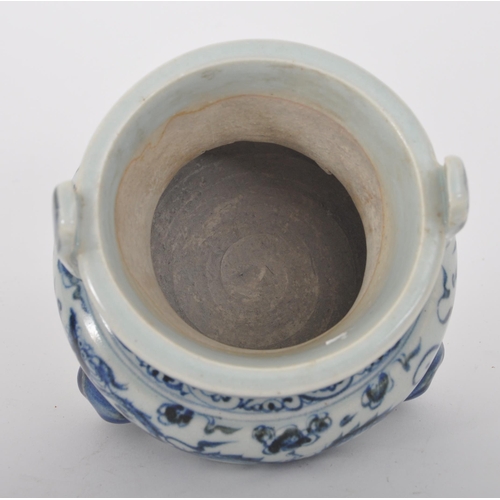 317 - A 19th century Chinese Qing Dynasty blue & white ceramic tripod censor. The censor having twin slip ... 