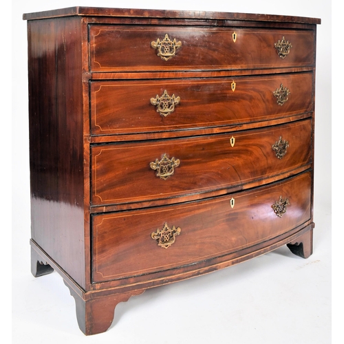 32 - A 19th century George III mahogany crossbanded bow front chest of drawers. The chest having a bank o... 