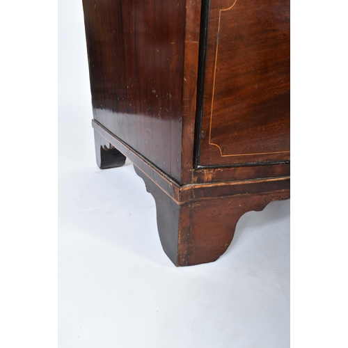 32 - A 19th century George III mahogany crossbanded bow front chest of drawers. The chest having a bank o... 