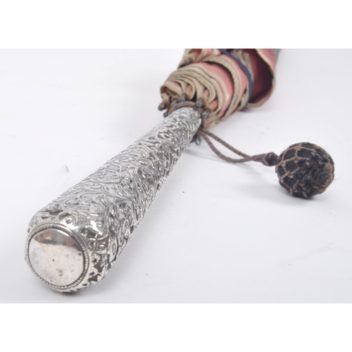 327 - A Victorian 19th century silver embossed handled ladies parasol umbrella. The umbrella having a flor... 