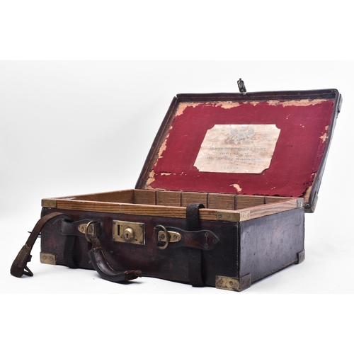 33 - James Woodward & Sons - An early 20th century leather and brass bound attaché case. The case once be... 