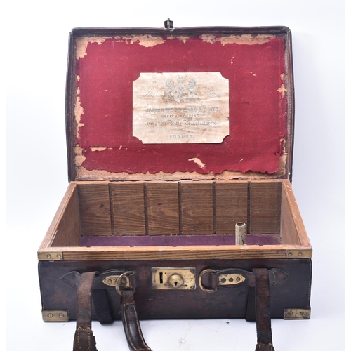 33 - James Woodward & Sons - An early 20th century leather and brass bound attaché case. The case once be... 