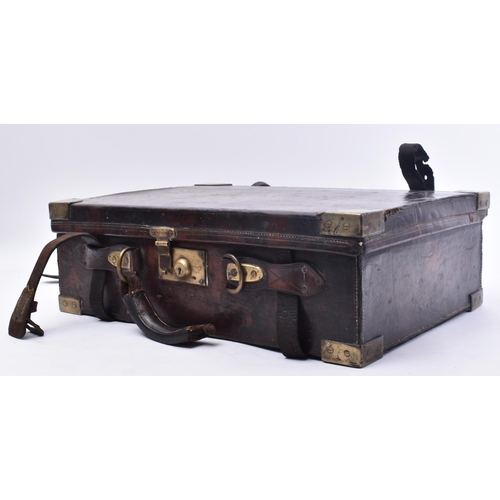 33 - James Woodward & Sons - An early 20th century leather and brass bound attaché case. The case once be... 