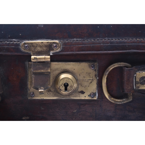 33 - James Woodward & Sons - An early 20th century leather and brass bound attaché case. The case once be... 