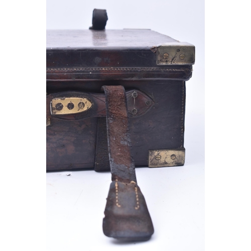 33 - James Woodward & Sons - An early 20th century leather and brass bound attaché case. The case once be... 