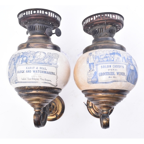 332 - A pair of early 20th century point of sale advertising brass wall oil lamp sconces. Each lamp having... 