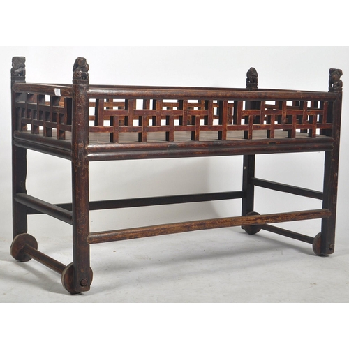 352 - A 19th century Chinese hardwood jardiniere - plant stand table. The top with large pierced gallery g... 