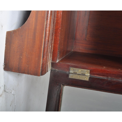 359 - A George III 18th century mahogany glazed twin library bookcase cabinet. The cabinet having a carved... 