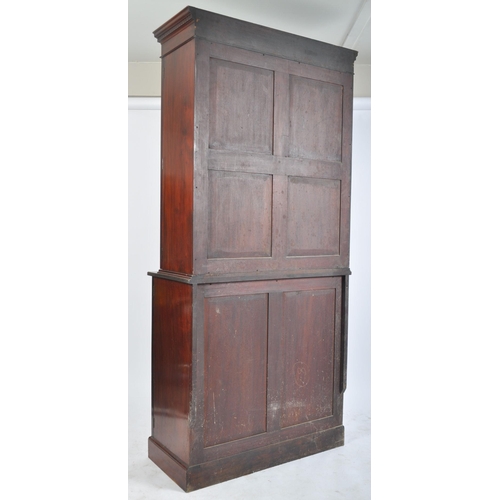 359 - A George III 18th century mahogany glazed twin library bookcase cabinet. The cabinet having a carved... 