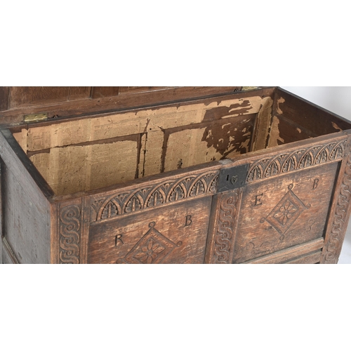 360 - A George III 18th century carved oak blanket box chest / coffer. The chest having a panelled hinged ... 