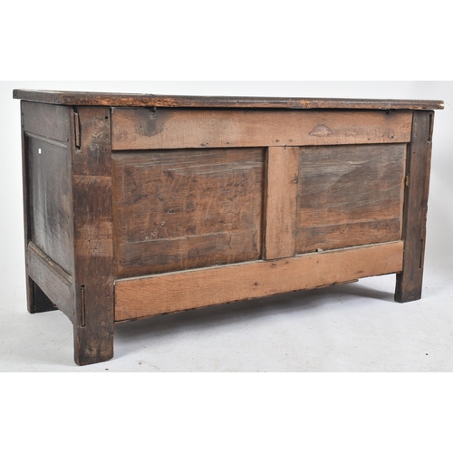 360 - A George III 18th century carved oak blanket box chest / coffer. The chest having a panelled hinged ... 