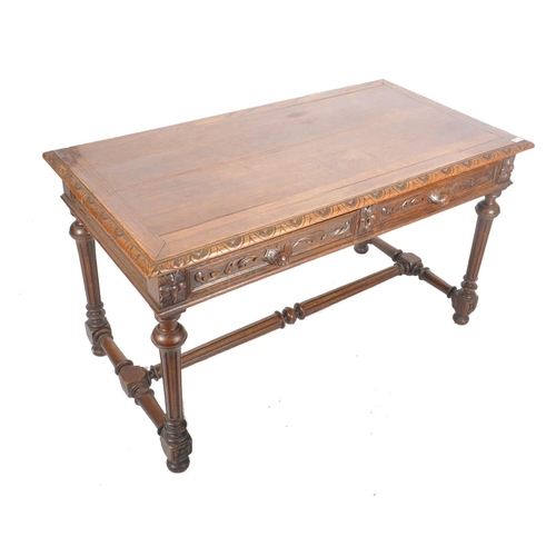 378 - A Victorian 19th century carved oak large writing table desk. The writing table having carved chamfe... 