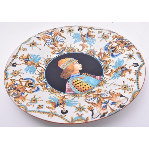 383 - A late 20th century hand painted Italian majolica charger / plate by Luciana Mari. The charger featu... 