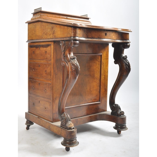 384 - A late 19th century Victorian walnut davenport writing bureau. The desk with inkwell stand shelf mou... 