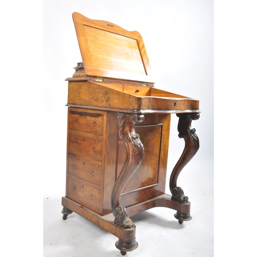 384 - A late 19th century Victorian walnut davenport writing bureau. The desk with inkwell stand shelf mou... 