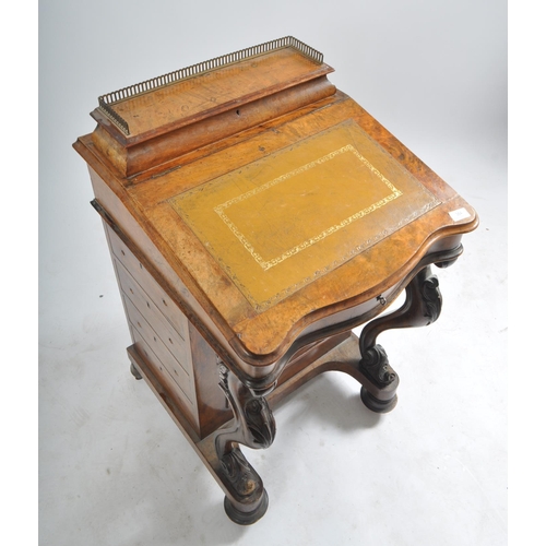 384 - A late 19th century Victorian walnut davenport writing bureau. The desk with inkwell stand shelf mou... 