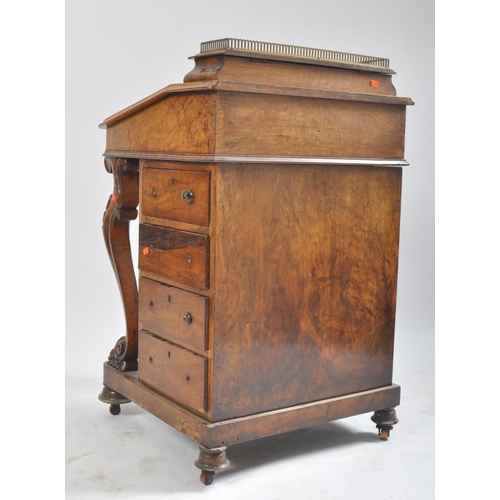 384 - A late 19th century Victorian walnut davenport writing bureau. The desk with inkwell stand shelf mou... 