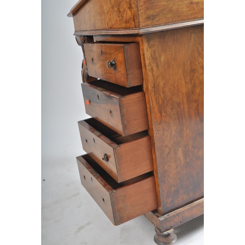 384 - A late 19th century Victorian walnut davenport writing bureau. The desk with inkwell stand shelf mou... 