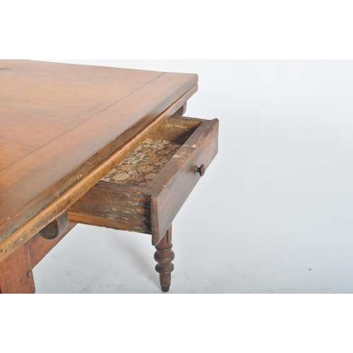 387 - A large Victorian 19th century walnut extending farmhouse refectory dining table. The table having a... 