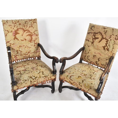 419 - A pair of 19th century French Louis XIV oak framed tapestry upholstered fireside high back armchairs... 