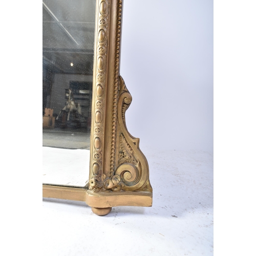 424 - A Victorian 19th century gilt wood & gesso over mantle mirror. The mirror having an intricate embell... 