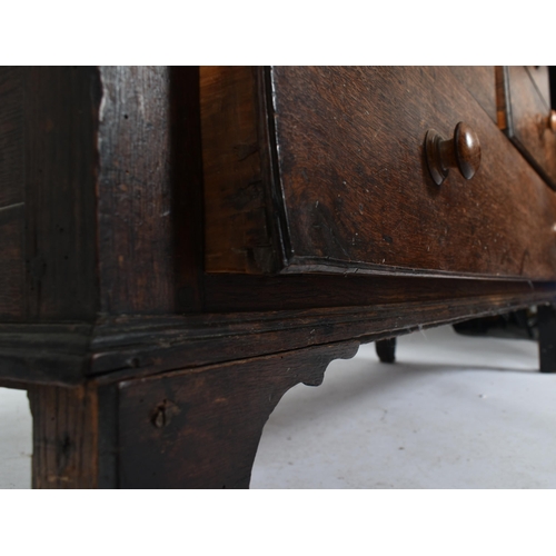 425 - An 18th century George III oak country house housekeeper's cupboard / linen press. The cupboard comp... 