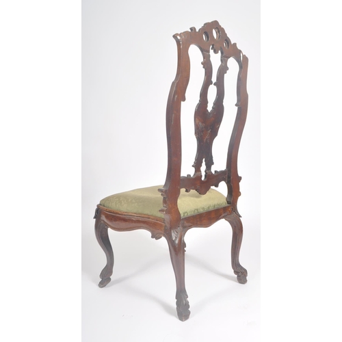 429 - A Queen Anne early 18th century walnut pierced back upholstered hall / dining chair. The chair havin... 