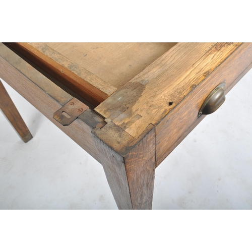 439 - An early 20th century railway / government oak writing table desk. Raised on square tapering legs wi... 