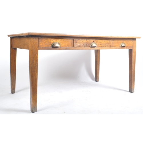 439 - An early 20th century railway / government oak writing table desk. Raised on square tapering legs wi... 