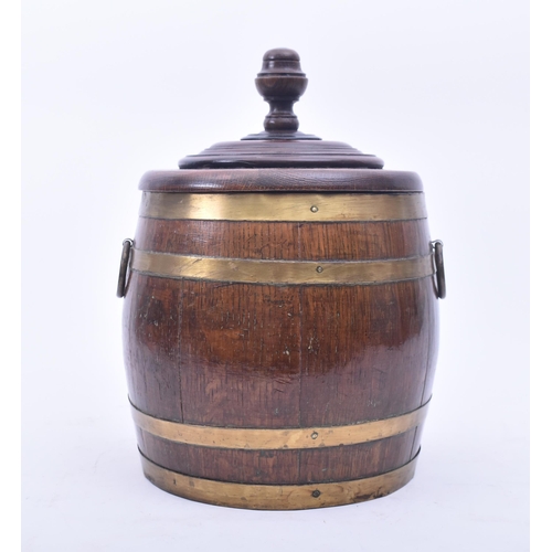 441 - A late Victorian 19th century oak & brass bound lidded Naval rum barrel. The barrel having a turned ... 